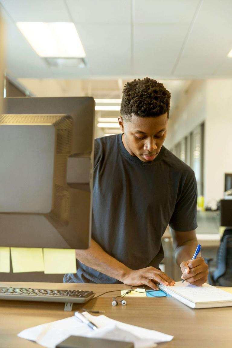 A young man designing a website for a small business.