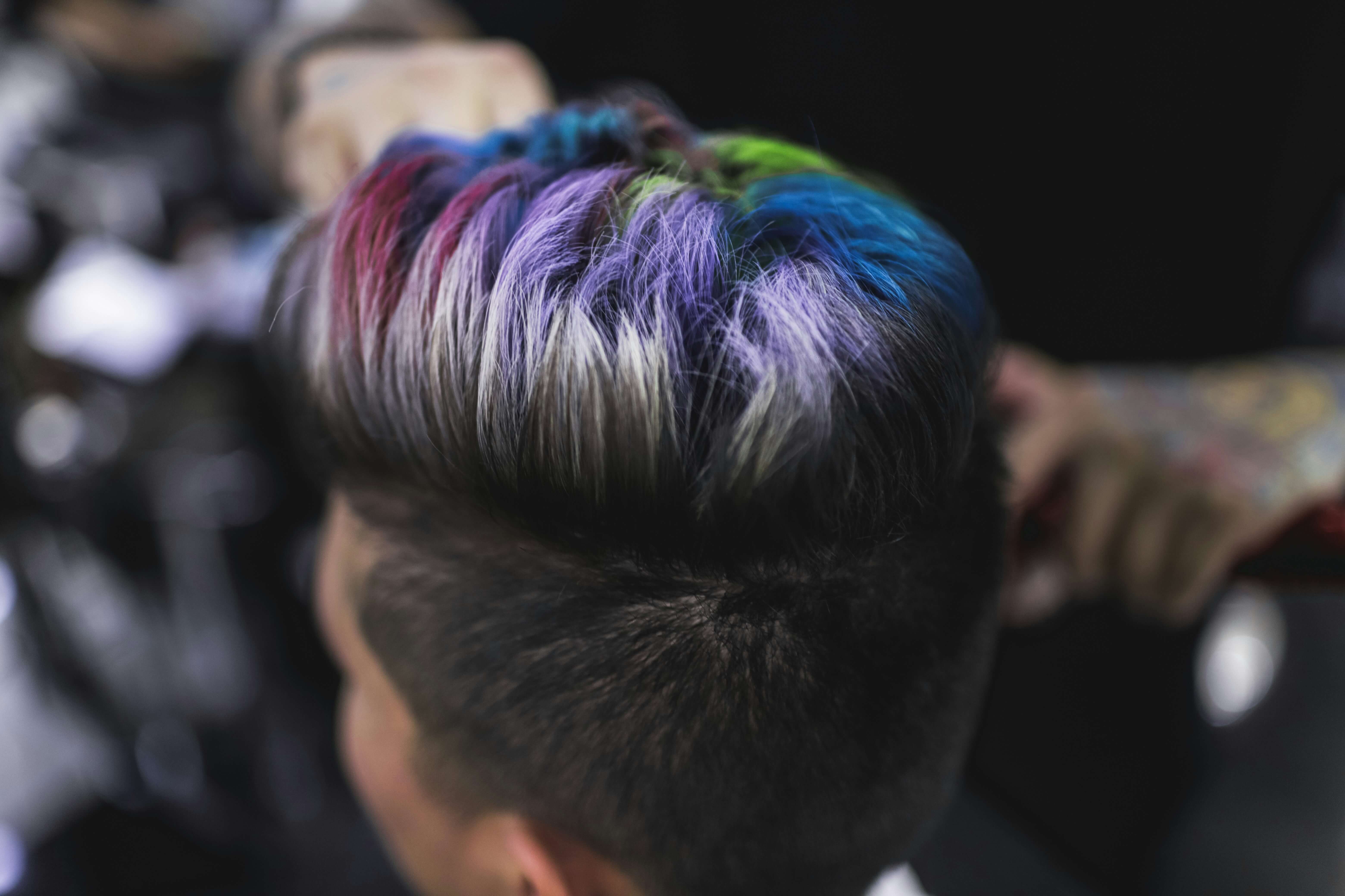 A woman getting styling done before a wedding.